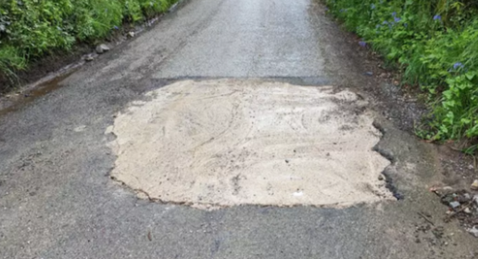 Motorist Takes Matters into Their Own Hands and Fills Giant Pothole in Cornwall